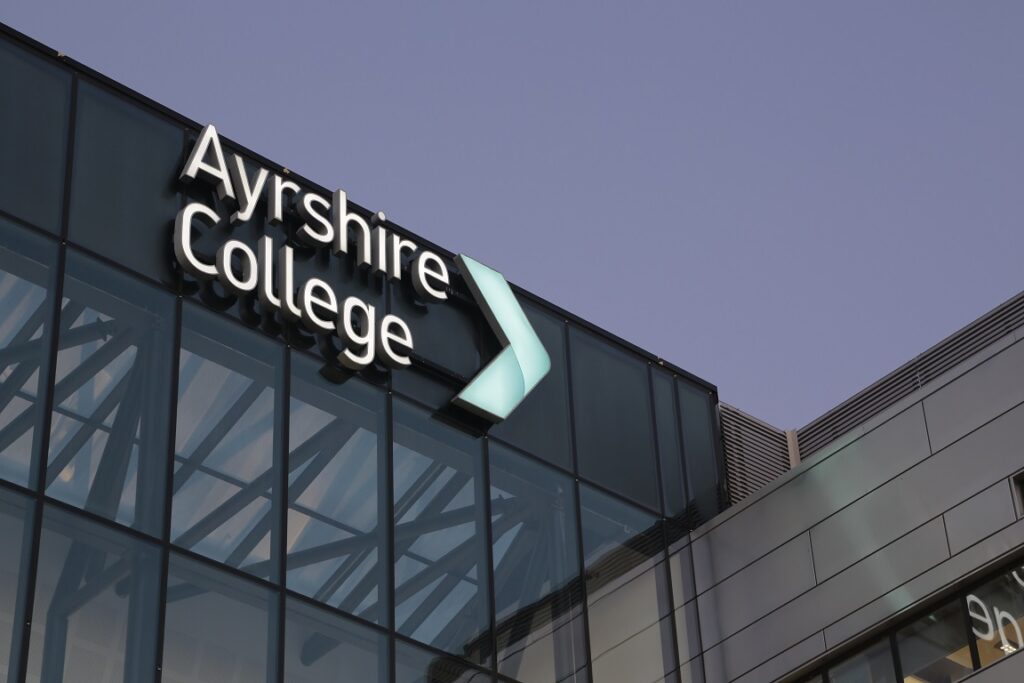 Ayrshire College Building Text with face illumination.