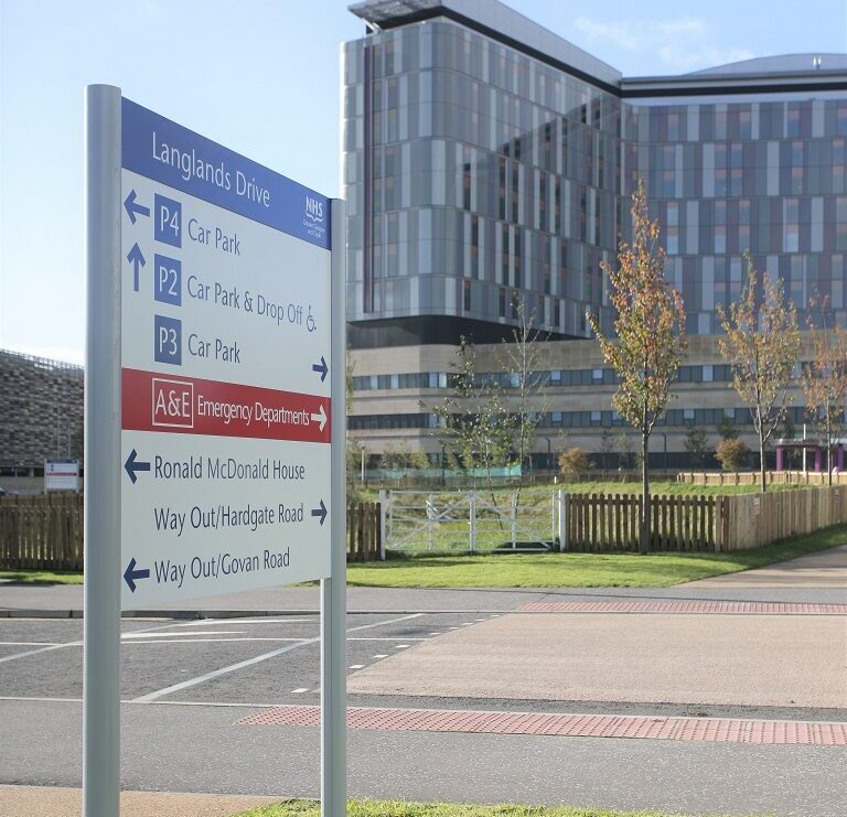 Queen Elizabeth University Hospital. NHS Post Mounted Traffic Direction Sign.