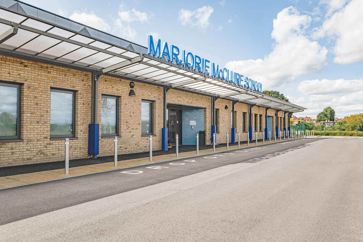 Marjorie McClure School External building text fitted to framework on canopy entrance.