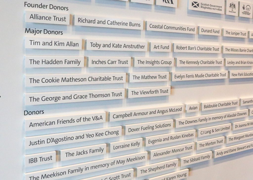 V&A Museum Dundee Donor names on painted folded aluminium panels with vinyl text applied to the face