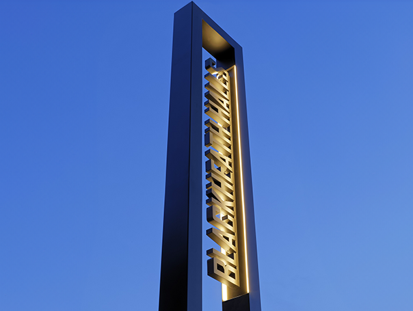 Blackheath Halls Built Up Illuminated text in Totem Frame at Dusk