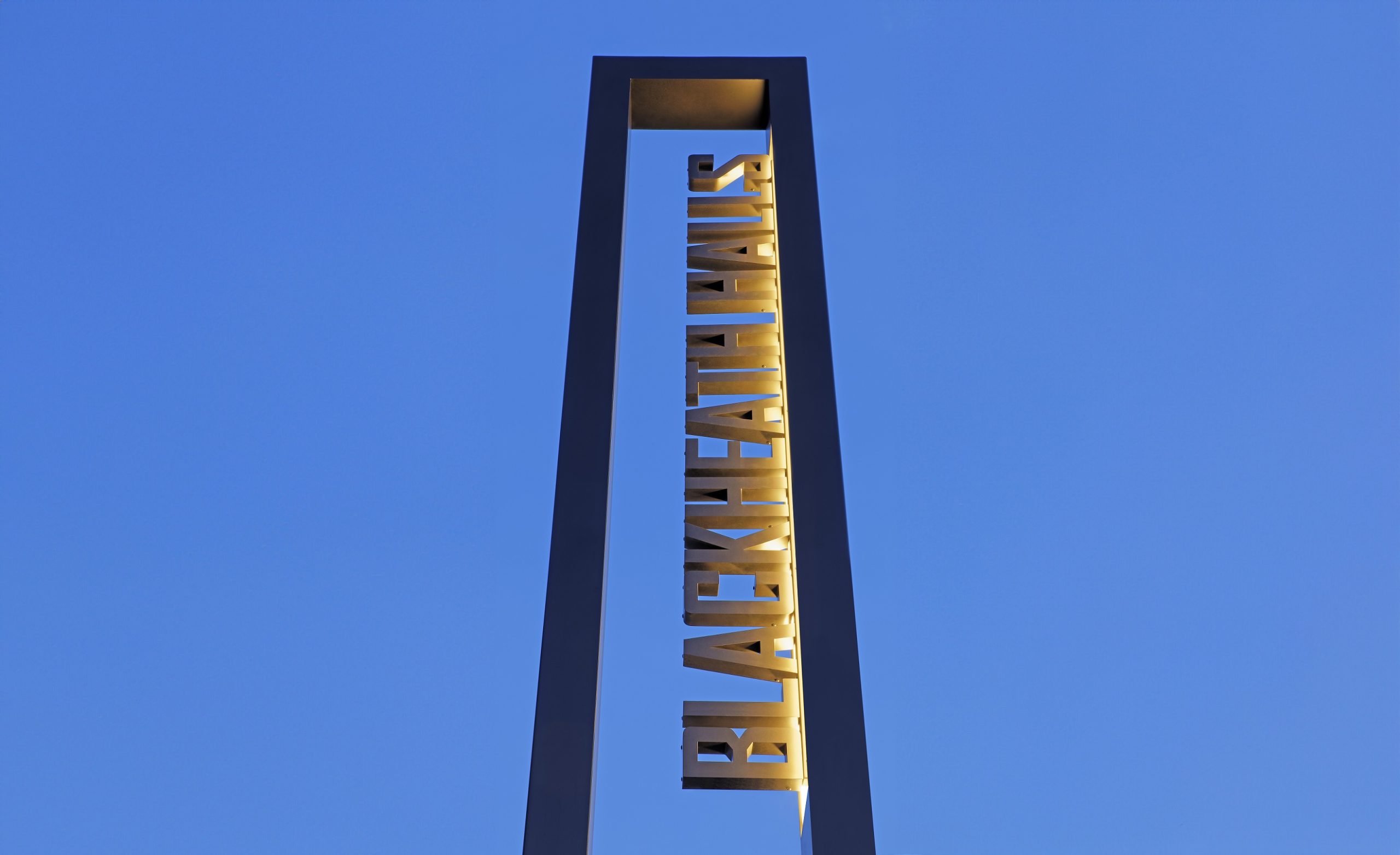 Blackheath Halls Built Up Illuminated text in totem frame at dusk