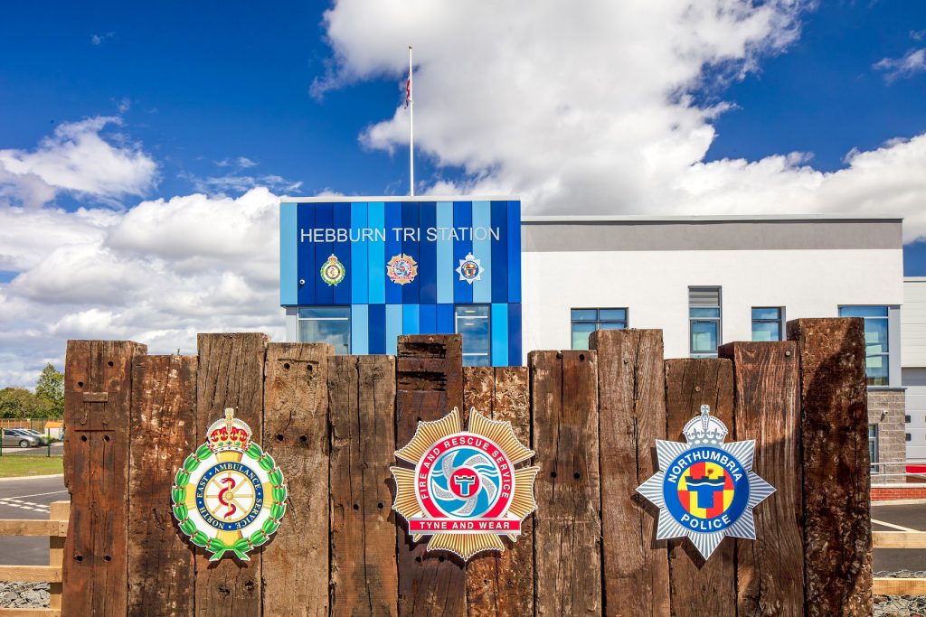 Hebburn Tri Station External Signage. Flat cut building text and digitally printed emergency services crests.
