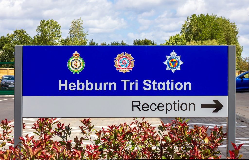 Hebburn Tri Station External Signage. Post mounted directional sign in car park directing people to the reception. Contrast in colour of text on a colour background.