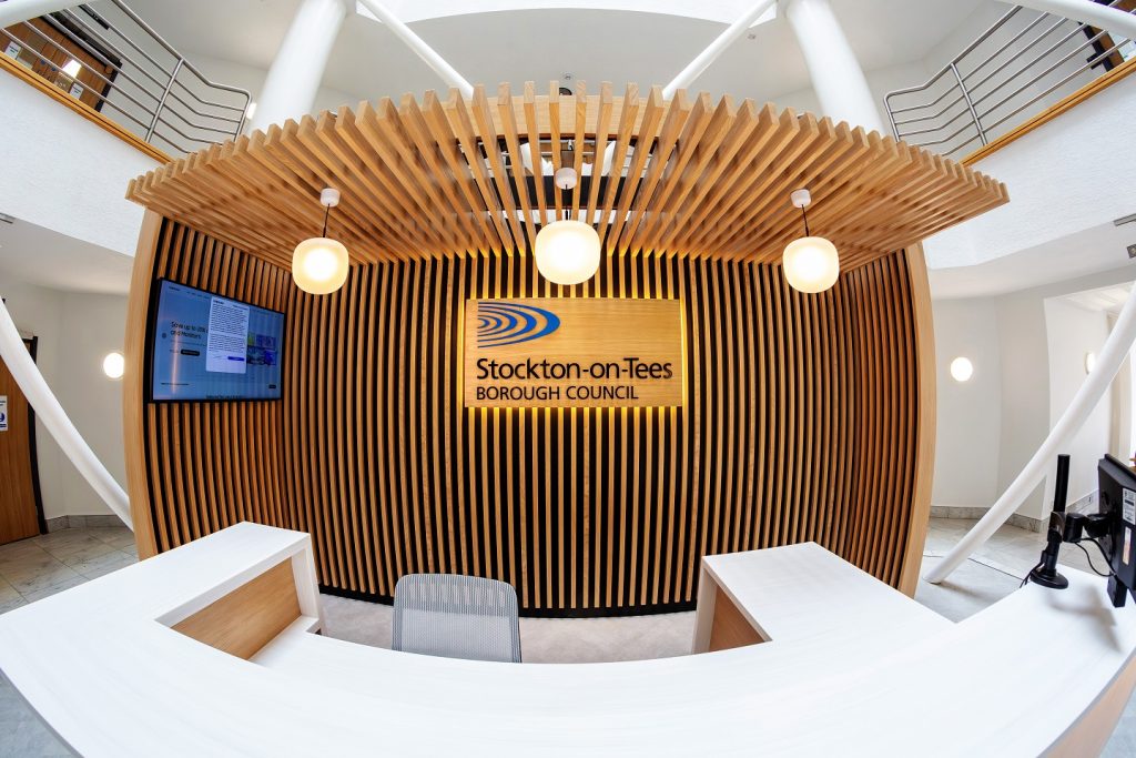 Dunedin House Main Reception sign. Timber panel with acrylic text and logo for Stockton on Tees Borough Council