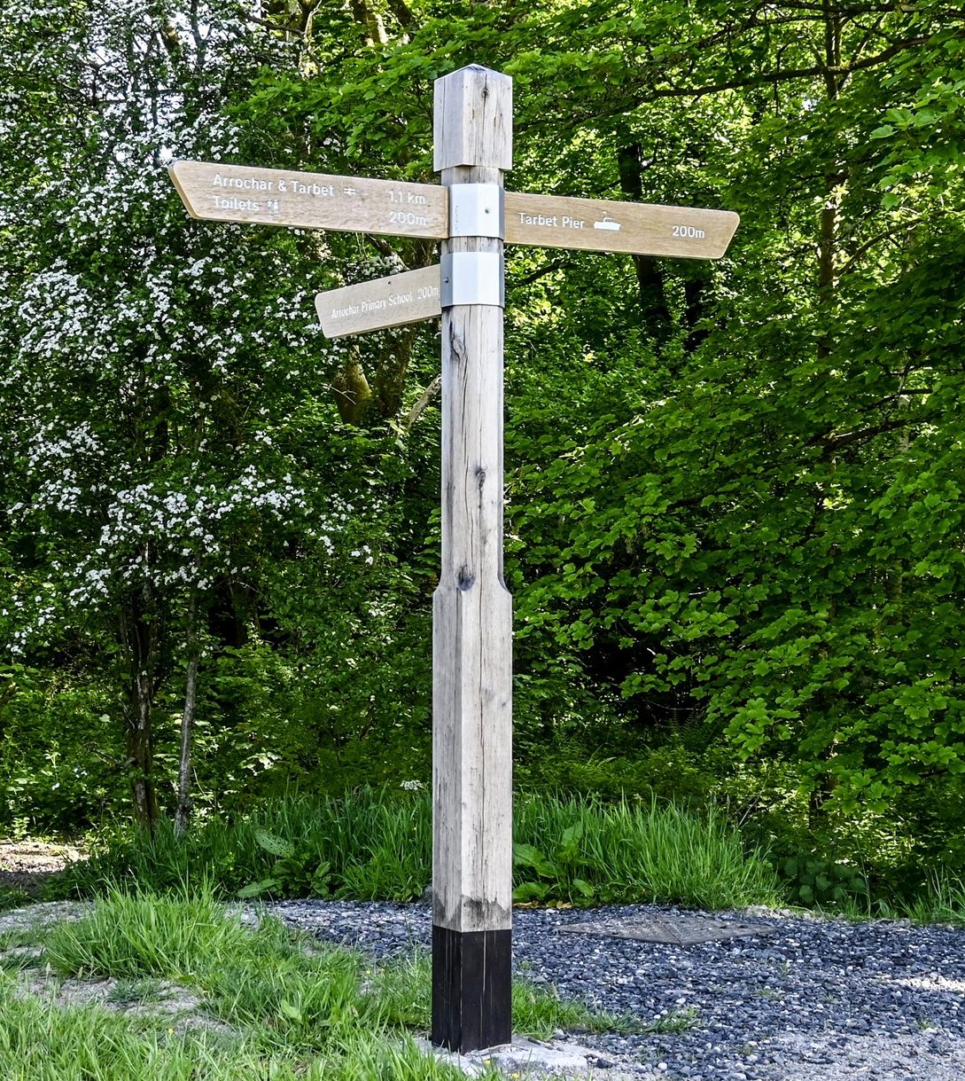 Tarbet Visitor Centre Green Oak Fingerpost wayfinding sign at a key location at the Loch Lomond Site