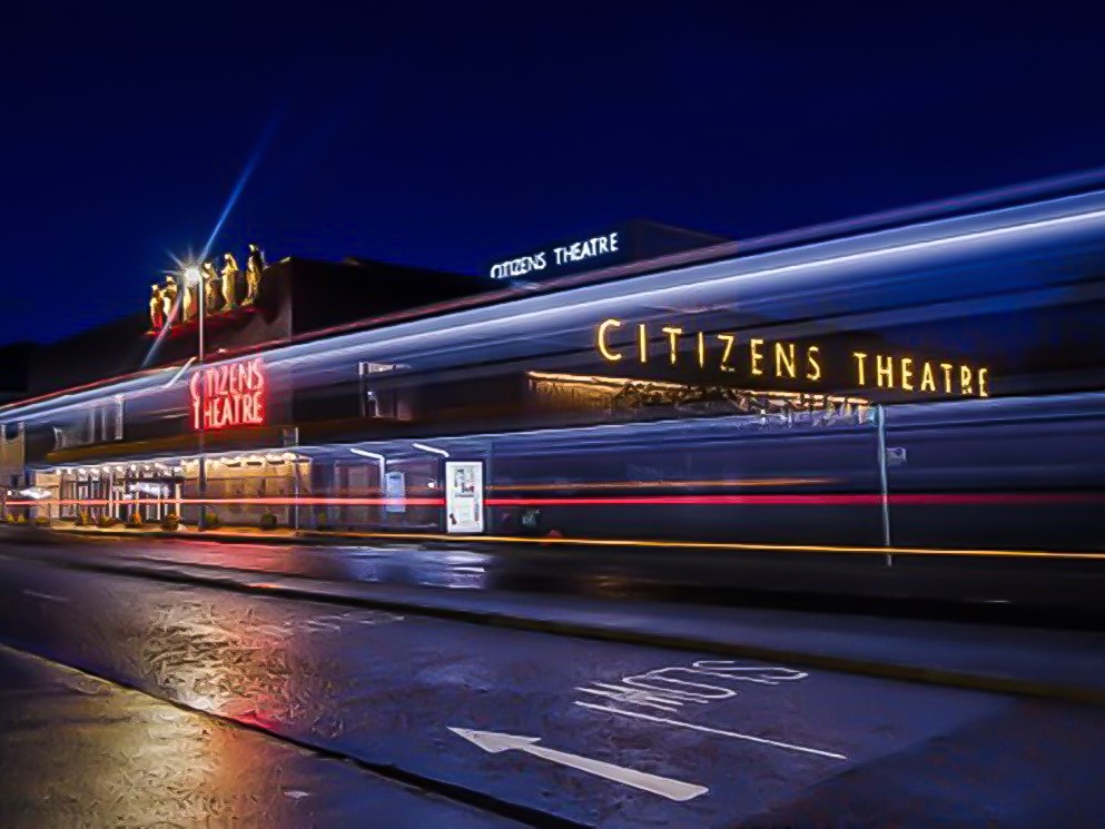 Citizens Theatre at Night. Illuminated Neon signage on the building facade.