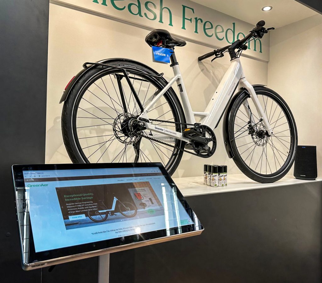 Digital screen. Touch screen showing details of a bike on show in a museum