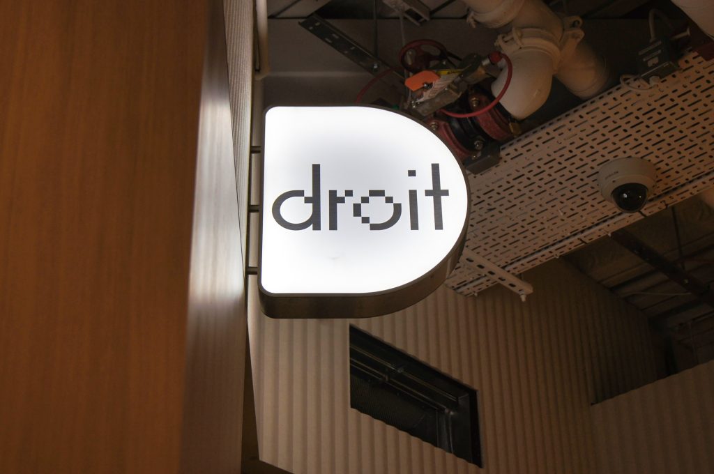 Broadgate Tower London. Illuminated projecting sign that reads droit