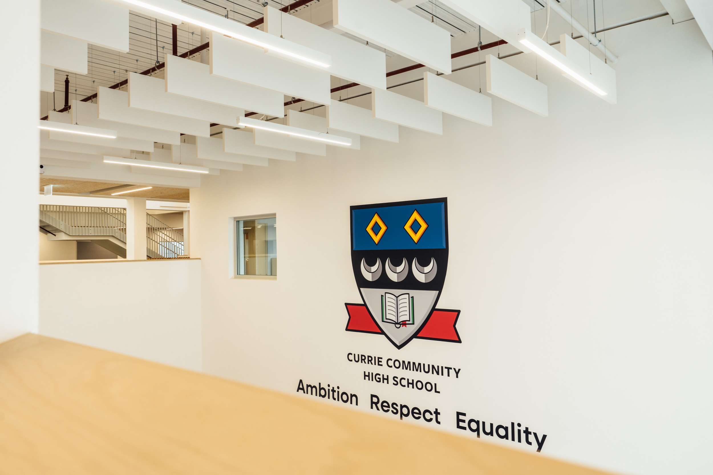 Currie Community High School Crest and Values in digitally printed vinyl applied to an internal painted wall.