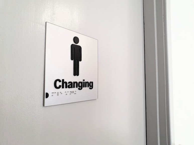 Braille and Tactile Changing Door Sign